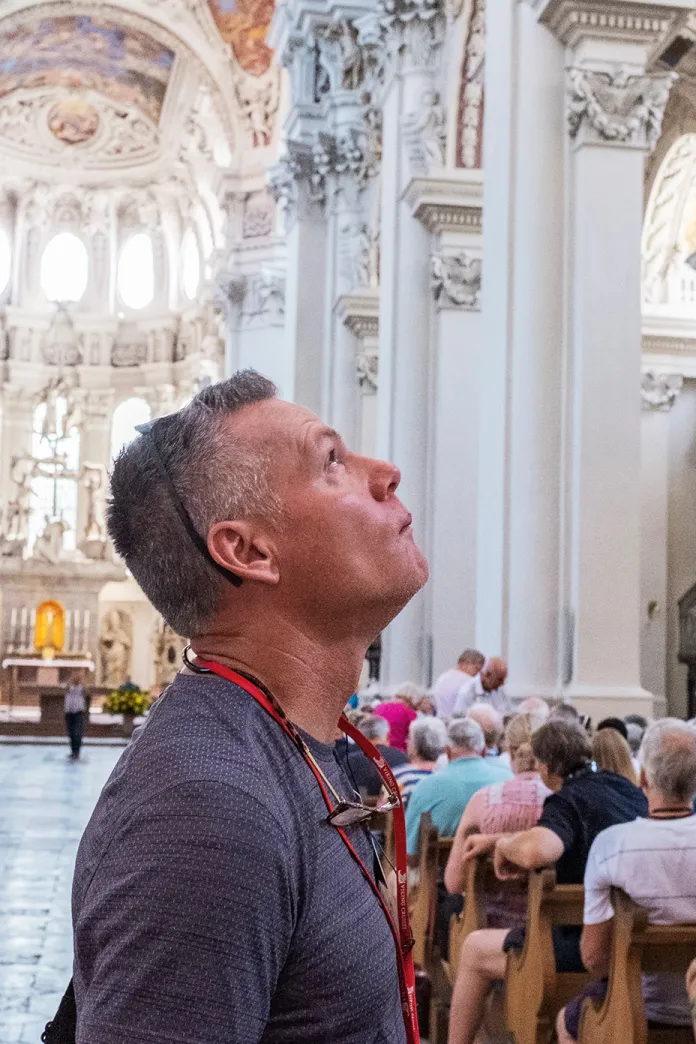 Man looking up in a cathedral