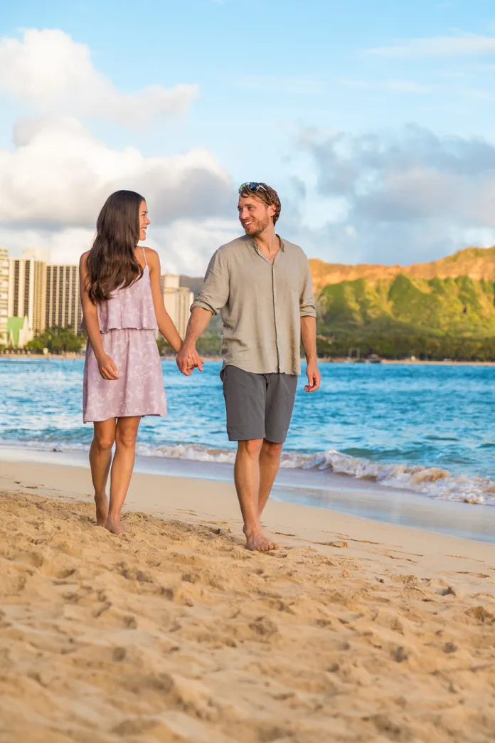 Couple walking along a beach