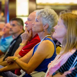 people sitting listening to a message